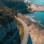 birds eye view of highway beside bay