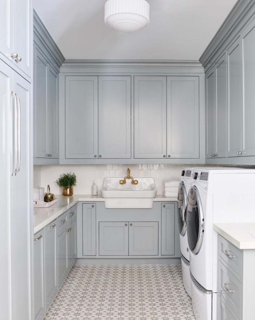 Laundry mudroom with cabinetry washer dryer and folding area