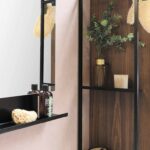 green potted plant on black wooden shelf
