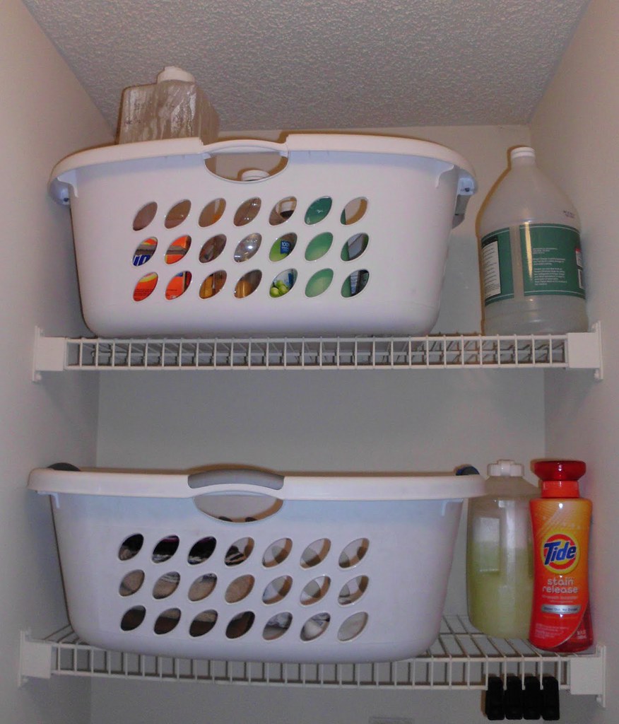 Laundry baskets and supplies organized on utility shelving