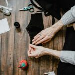 Hand sewing a face mask with pins