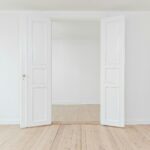 Door in a white room