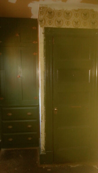 Corner hutch and door to attic stairwell