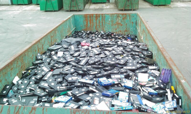 Discarded VHS tapes metaphor for hidden secrets