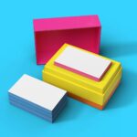 a group of three different colored boxes on a blue background