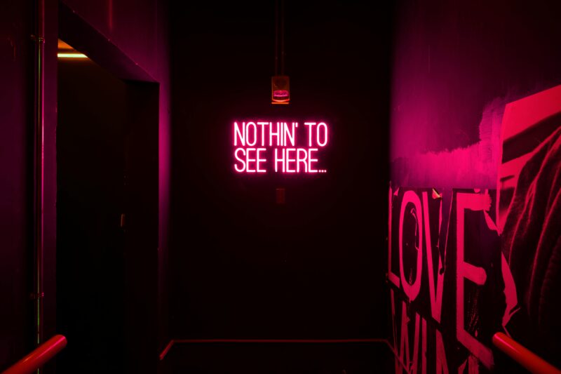 Neon sign Where is Here in artistic setting