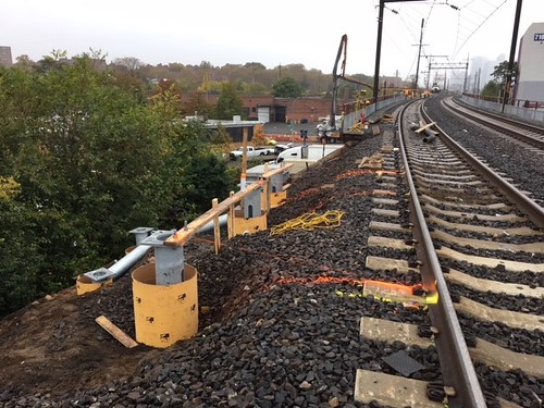Installation of helical piles to support trough at track level along a train bridge in Woodside, Queens. (CQ033, 11-05-2017)
