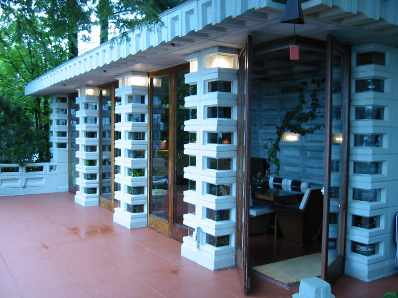 Floor-level continuity demonstrated with matching interior and exterior tile surfaces.