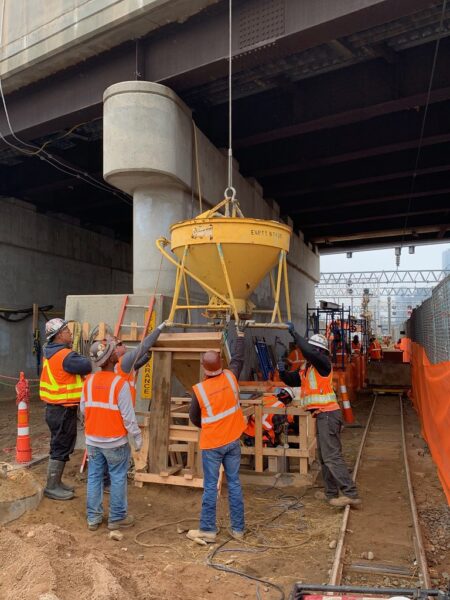 Pouring concrete over the rebar-reinforced track underpinning pit on the east side of the 39th Street Bridge. 05-08-2019