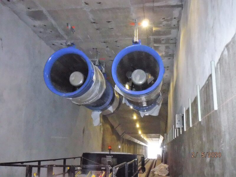 Installing booster fans for ventilation of the tunnel at one of the approach structures in Queens.