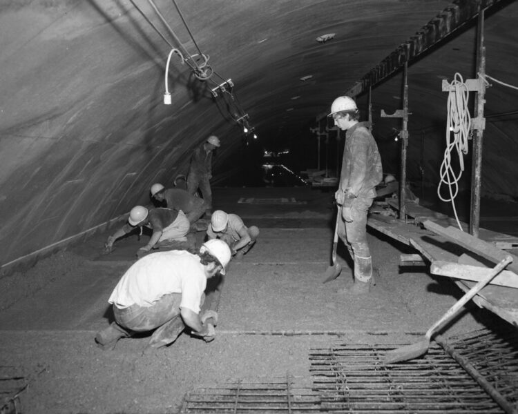 Big Walker Mountain Tunnel concrete finishing operation on the roof of the tunnel.