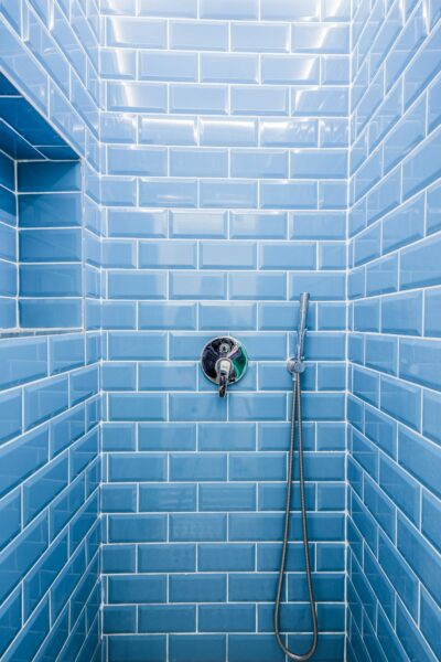 Blue wall bricks in a bathroom shower