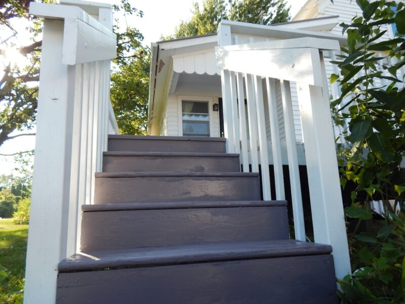 Wooden deck stairs leading to a house
