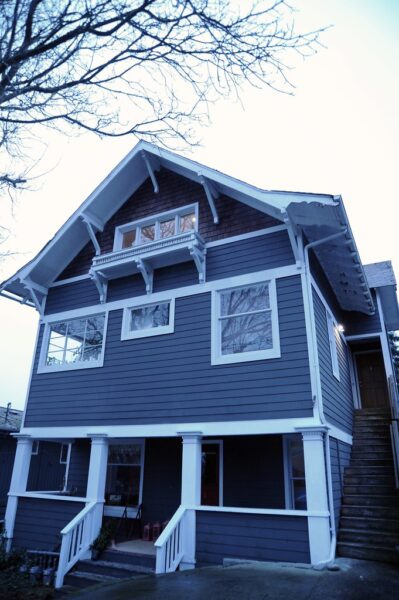 Classic 3 story apartment rental house, gray blue with white trim