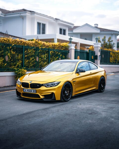 Stunning yellow luxury car parked on a residential street in Ankara, Türkiye.