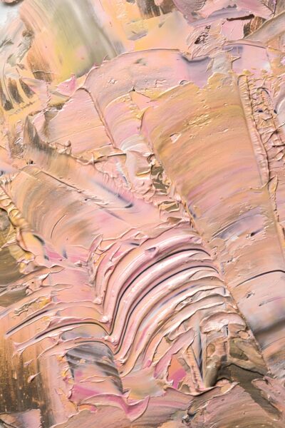 Close-up of an abstract oil painting with pastel colors and rich texture.