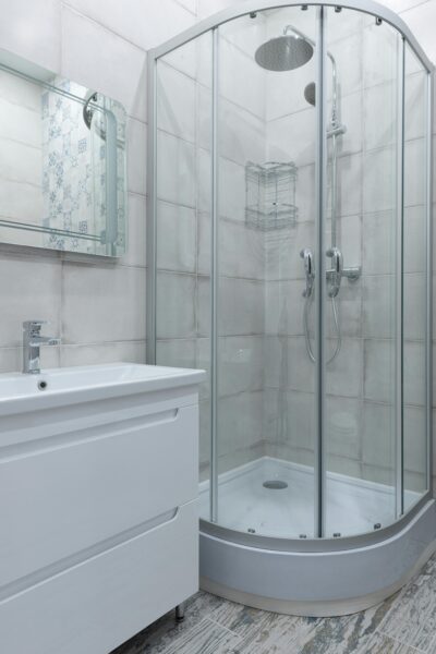 Contemporary bathroom featuring a glass shower and stylish fixtures.