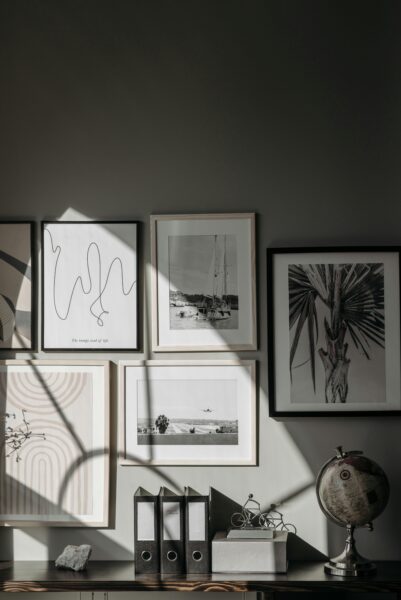 Stylishly arranged wall frames and decor create a contemporary interior space.