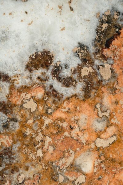 Close-up of textured marble with brown, beige, and white patterns.