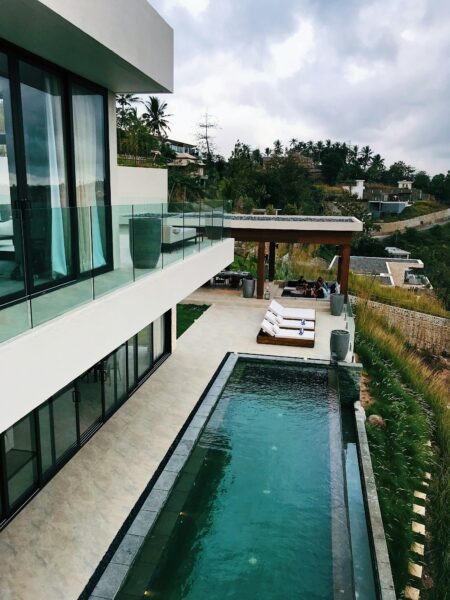 Explore this luxurious resort villa with a stunning infinity pool set in a beautiful Indonesian landscape.