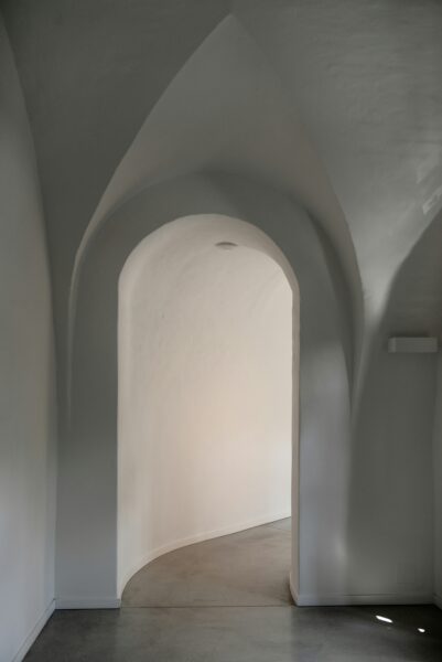 Concrete pathway inside white building