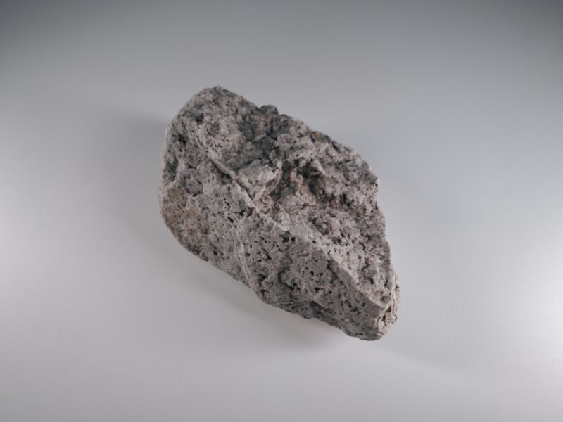 Brown rock on white surface