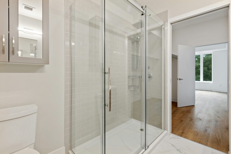 Clear glass door with white steel frame