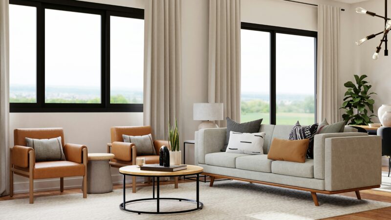 A view of a living room filled with furniture and a large window.