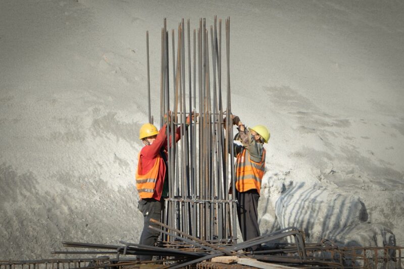 Two men working on a construction site
