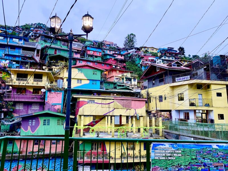 A bunch of colorful houses that are next to each other