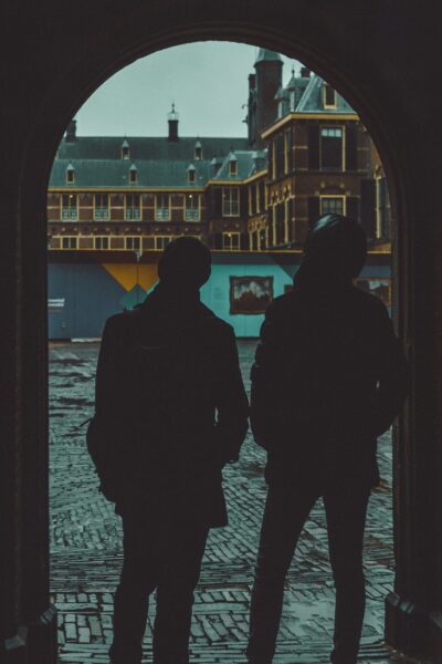 a couple of men standing next to each other