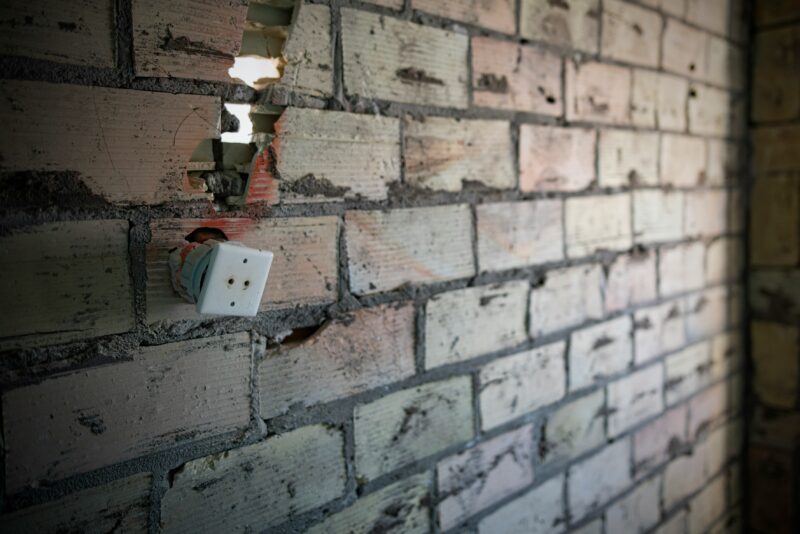 A brick wall with a light on it.