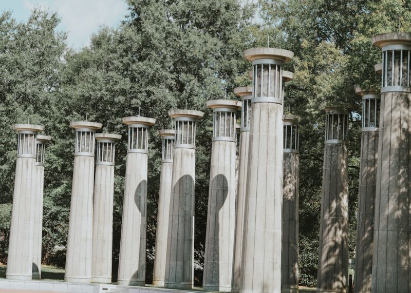 A row of cement pillars sitting next to each other.