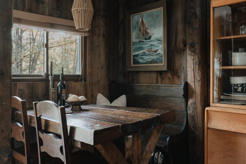 A wooden table and chairs in a room
