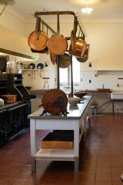 Kitchen filled with lots of pots and pans.