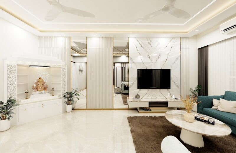 A bright, airy living room with off-white and cream tones, featuring polished beige tile flooring.
