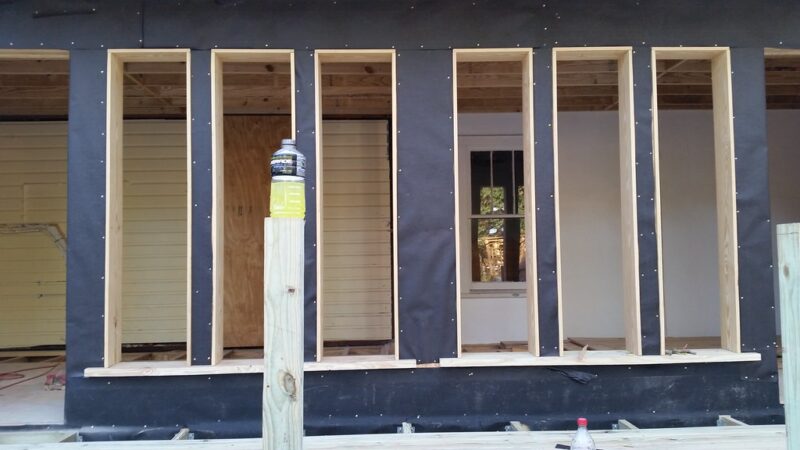Six fixed window openings framed ready to measure for glass I think. Two glass doors with blinds between. Left is kitchen addition, right is sitting area added to master.