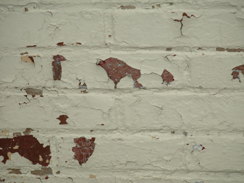 Whitewashed brick wall with rustic texture