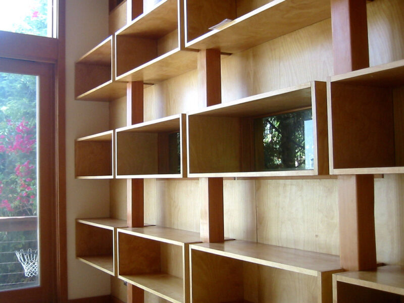 Wall of shelves showcasing a modern and organized garage space