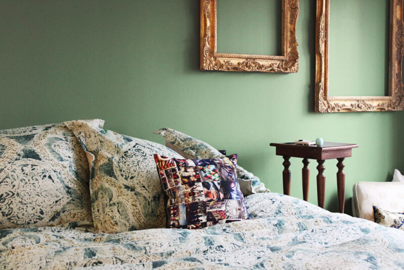 Green Master Bedroom with antique design elements.
