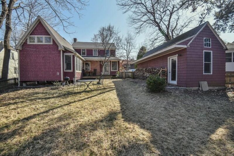 Examining the blend of new garage and home exterior design from the rear.