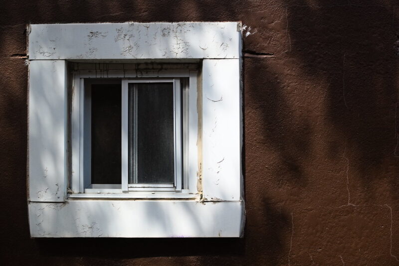 Window and the Brown Wall