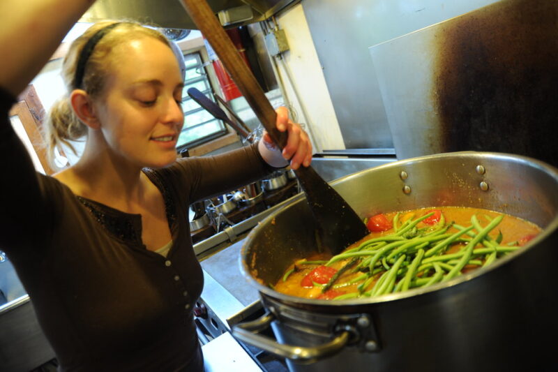 Cooking vegetarian green bean soup in a pot