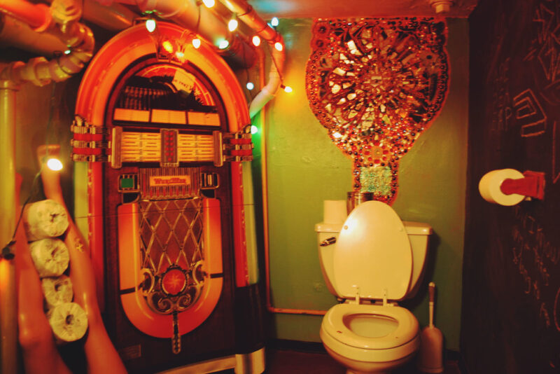 A decorated eclectic bathroom.