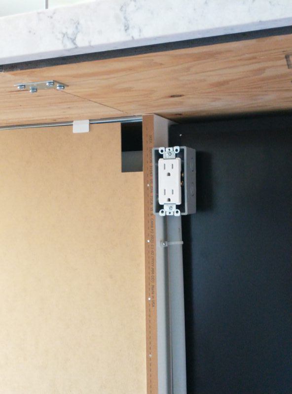 US Electrical Outlet (Unfinished) under a Bar Overhang