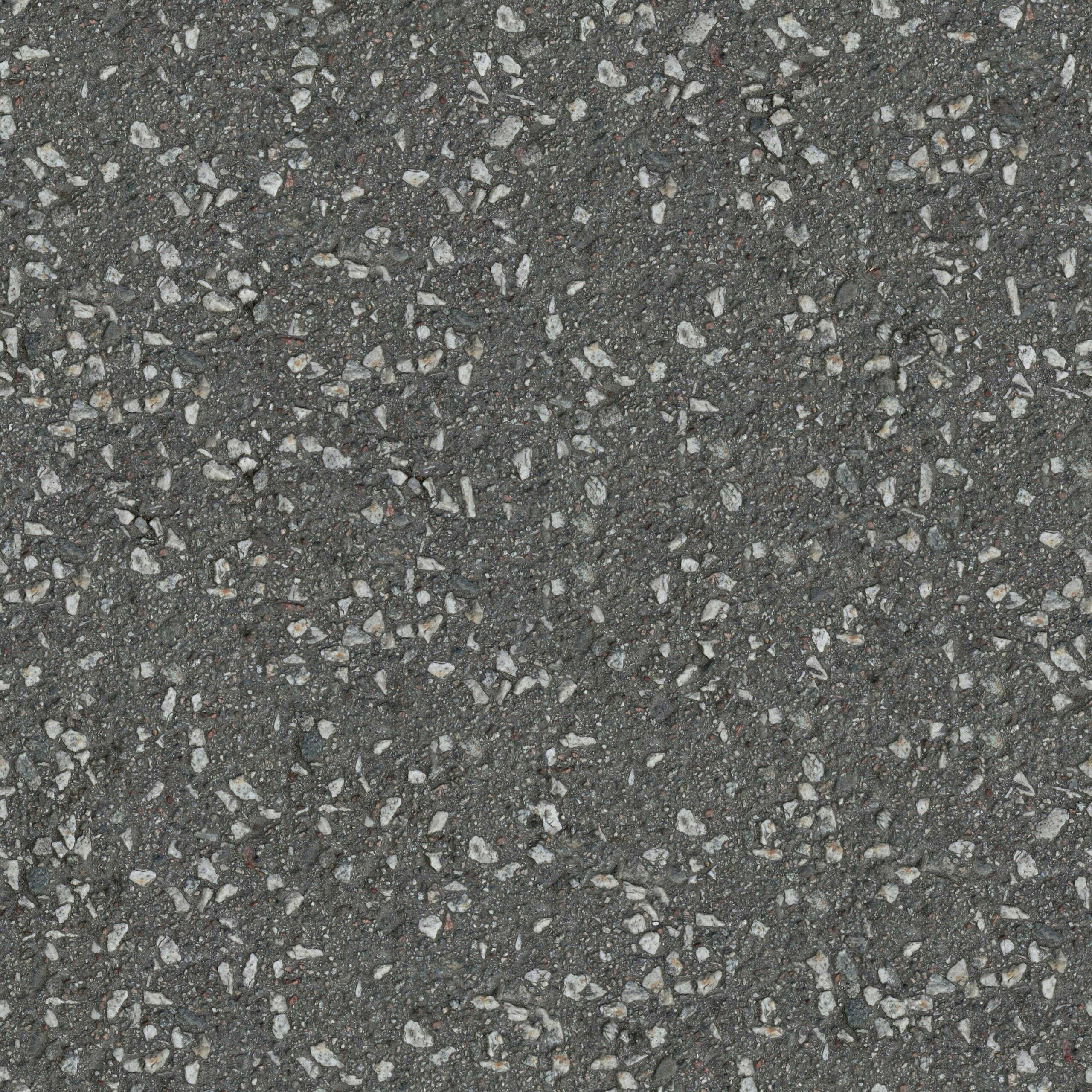 High-resolution close-up image of asphalt pavement showing texture and small stones.