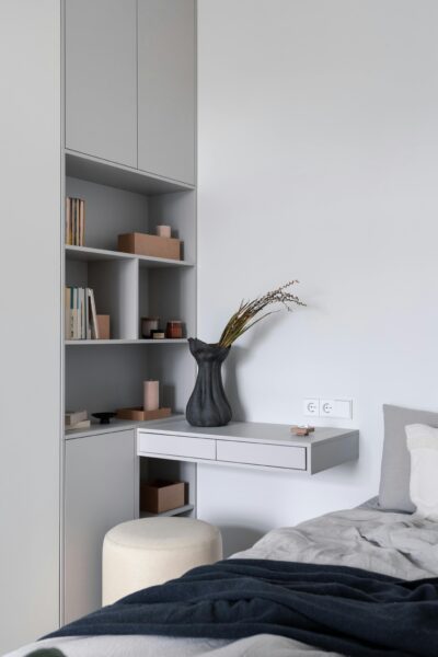 Modern and cozy bedroom interior in Saint Petersburg, featuring elegant minimalism.