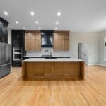 Modern kitchen island with warm layered lighting