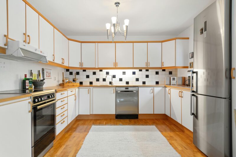 Bright, spacious kitchen featuring wooden accents and modern appliances.