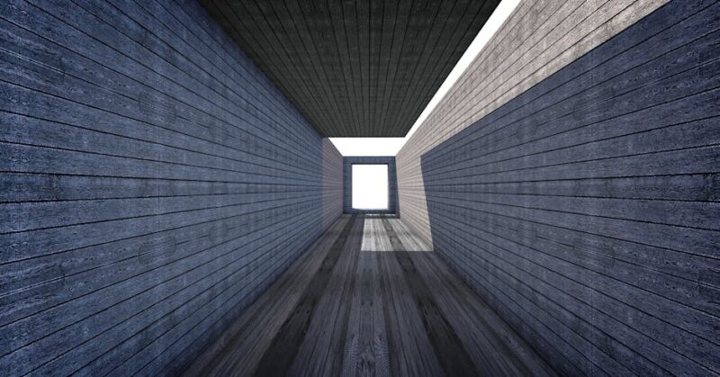Geometric wooden structure with bright lighting.